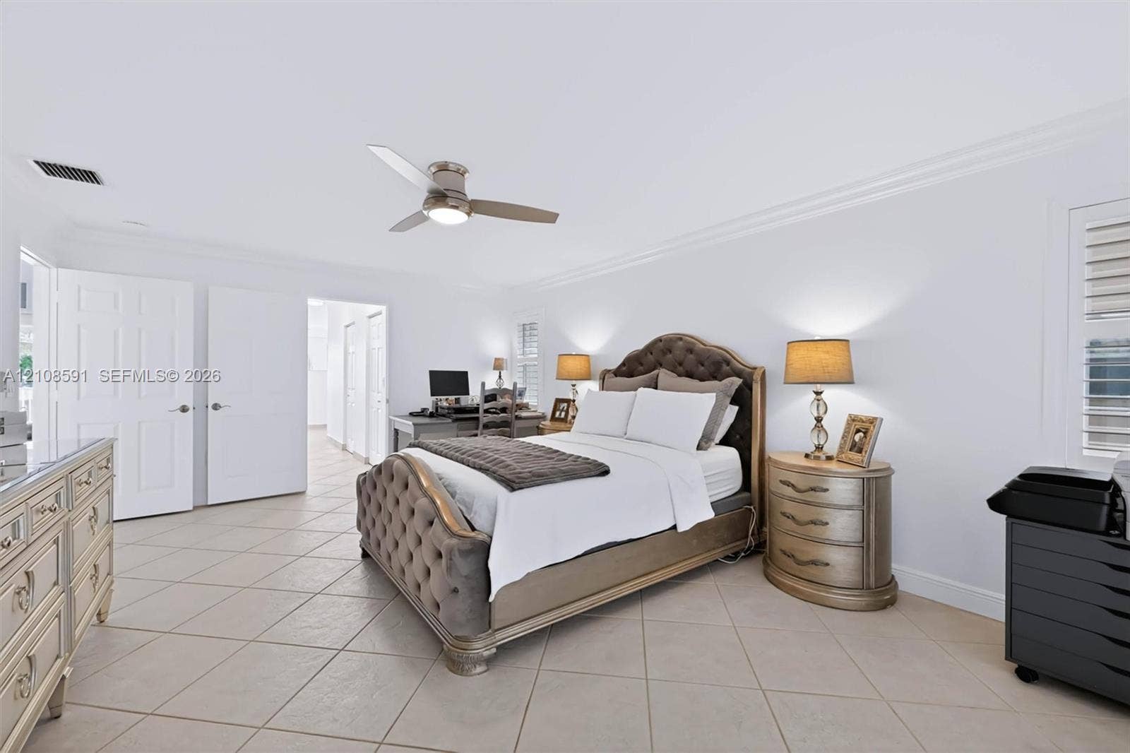 415 SW 200th Terrace, Pembroke Pines, FL 33029 Neutral tile flooring, crown molding, multi-panel doors, and a ceiling fan with integrated lighting