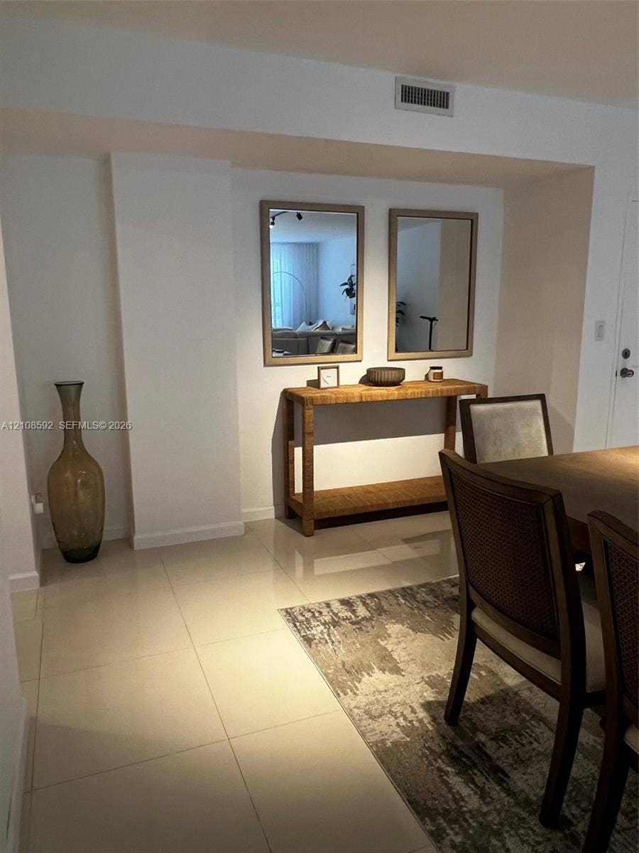 10185 Collins Avenue, #515, Bal Harbour, Bal Harbour, FL 33154 Large-format tile flooring complemented by recessed wall mirrors and smooth finish wall surfaces