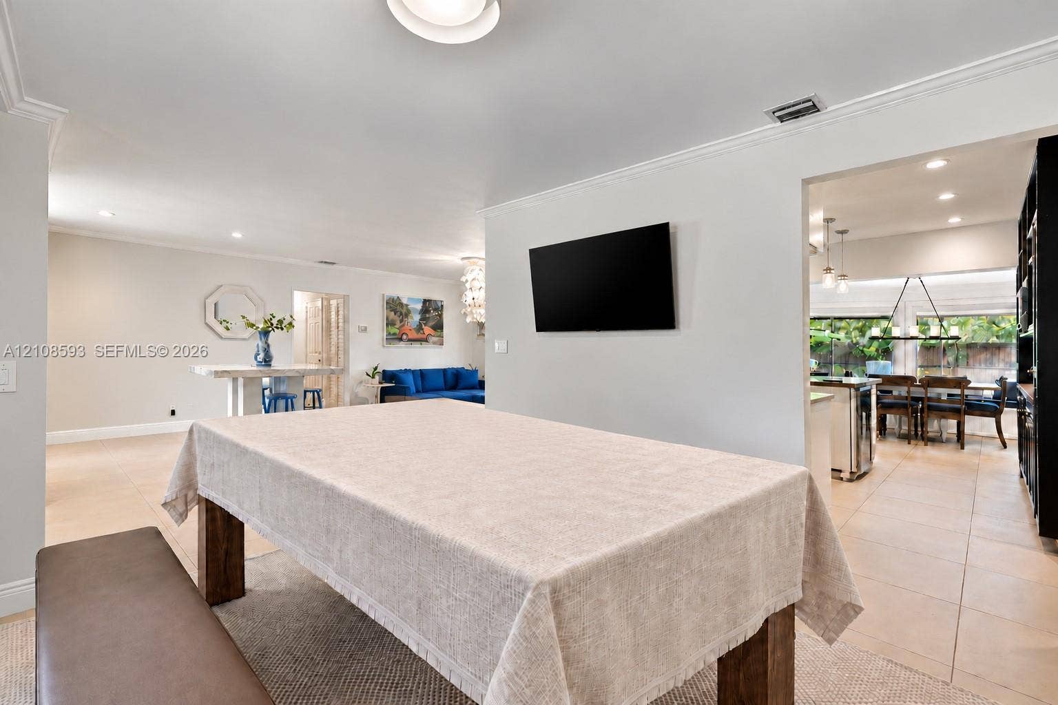 8230 SW 151st Street, Palmetto Bay, FL 33158 Neutral-toned interior featuring recessed lighting, smooth-finish ceiling, crown molding, and large-format tile flooring