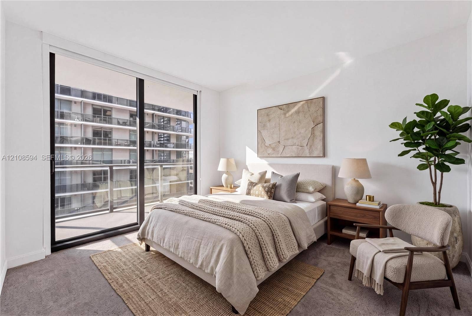 45 SW 9th Street, #2206, Miami, FL 33130 Floor-to-ceiling sliding glass door, private balcony, neutral wall-to-wall carpeting, and bright interior finish