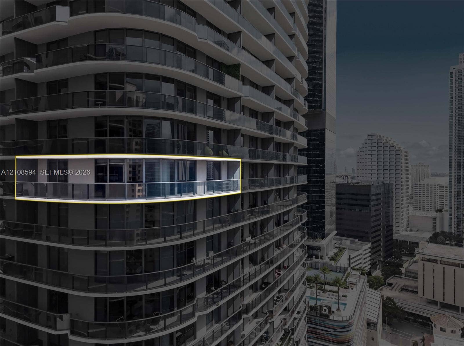 45 SW 9th Street, #2206, Miami, FL 33130 High-rise exterior featuring curved structural balconies with glass railings and floor-to-ceiling glass paneling
