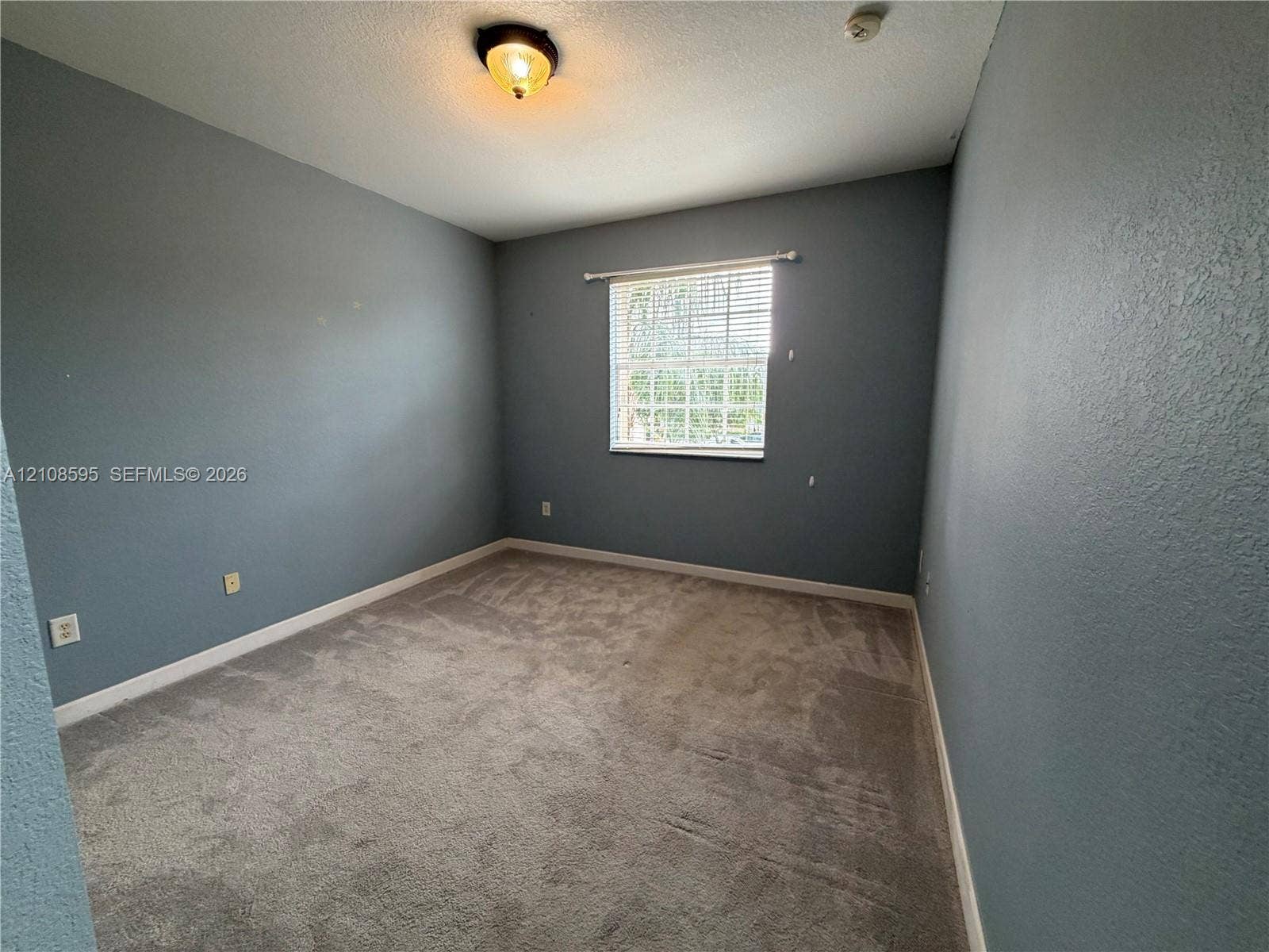 12989 SW 135th Terrace, #0, Miami, Miami, FL 33186 Room featuring wall-to-wall carpeting, a single window with horizontal blinds, and ceiling-mounted dome lighting