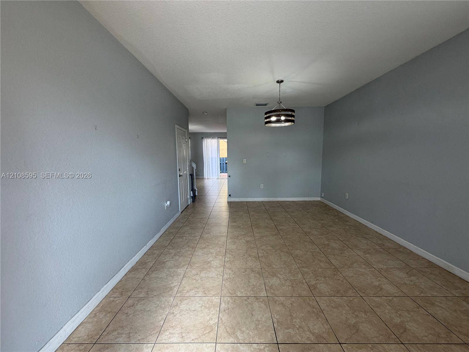 12989 SW 135th Terrace, #0, Miami, Miami, FL 33186 Interior space featuring ceramic tile flooring, neutral wall paint, and a drum-style ceiling light fixture