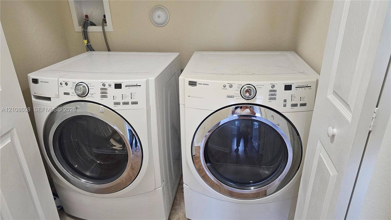 24041 SW 114th Place, Homestead, FL 33032 Dedicated laundry alcove equipped with wall-mounted water supply lines and recessed connections