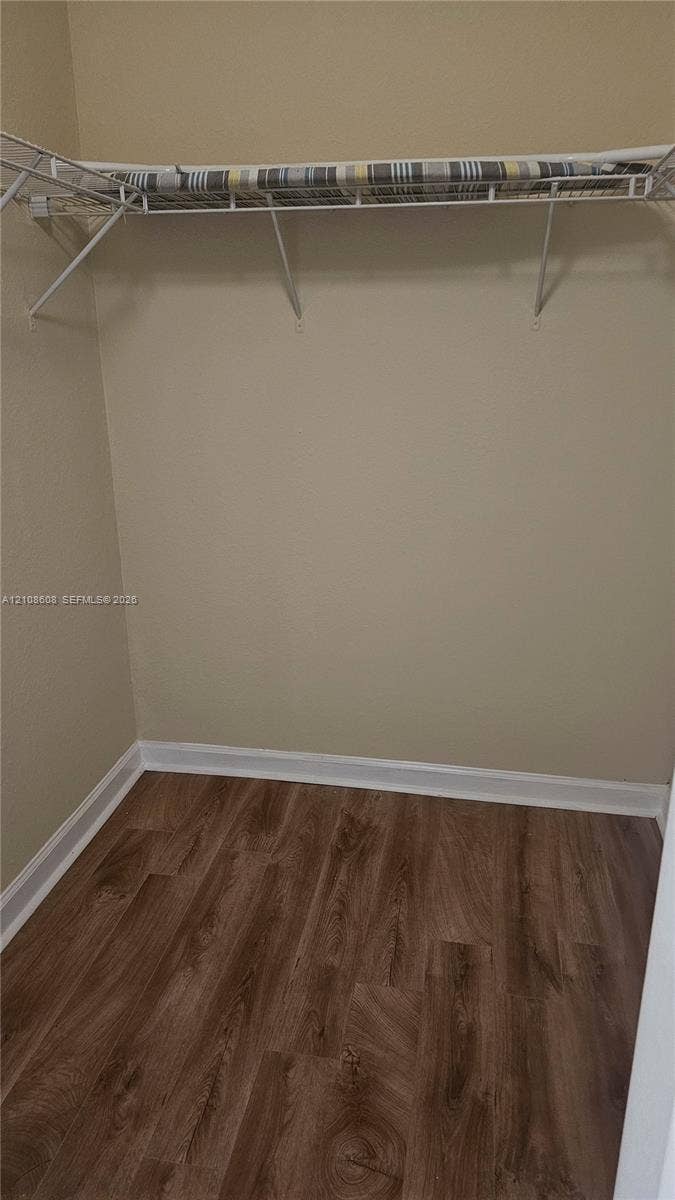 24041 SW 114th Place, Homestead, FL 33032 Storage area featuring wood-finish flooring and integrated wire shelving