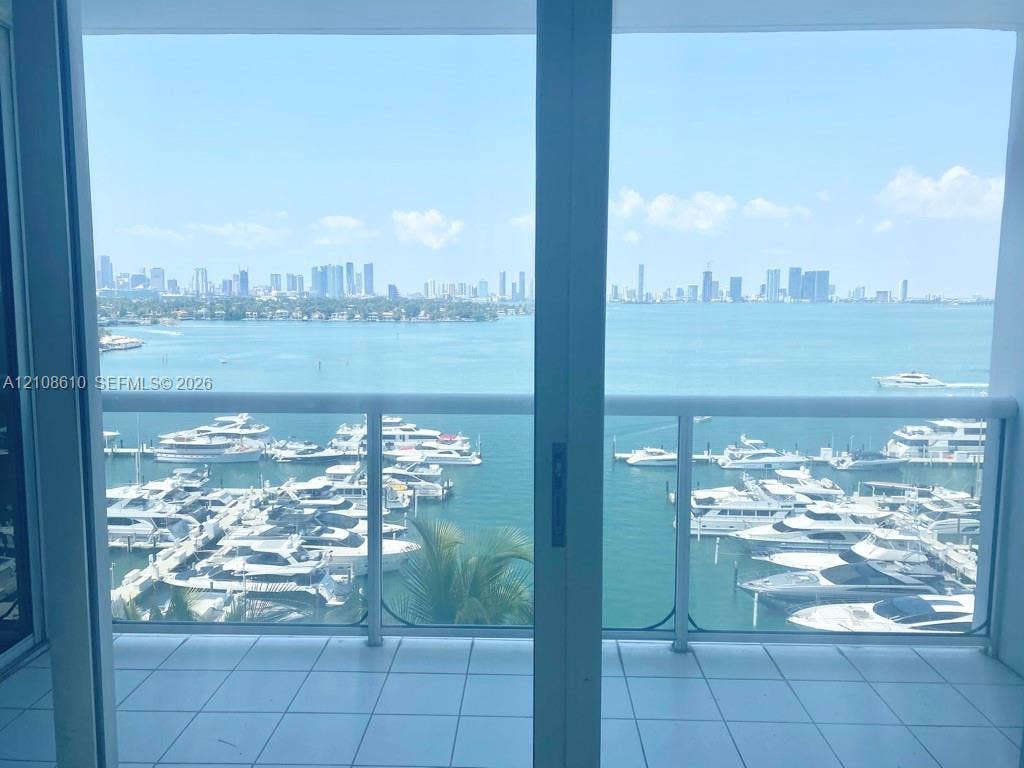 1900 Sunset Harbour Drive, #1210, Miami Beach, Miami Beach, FL 33139 Balcony featuring ceramic tile flooring, a white metal frame, and glass panel railing