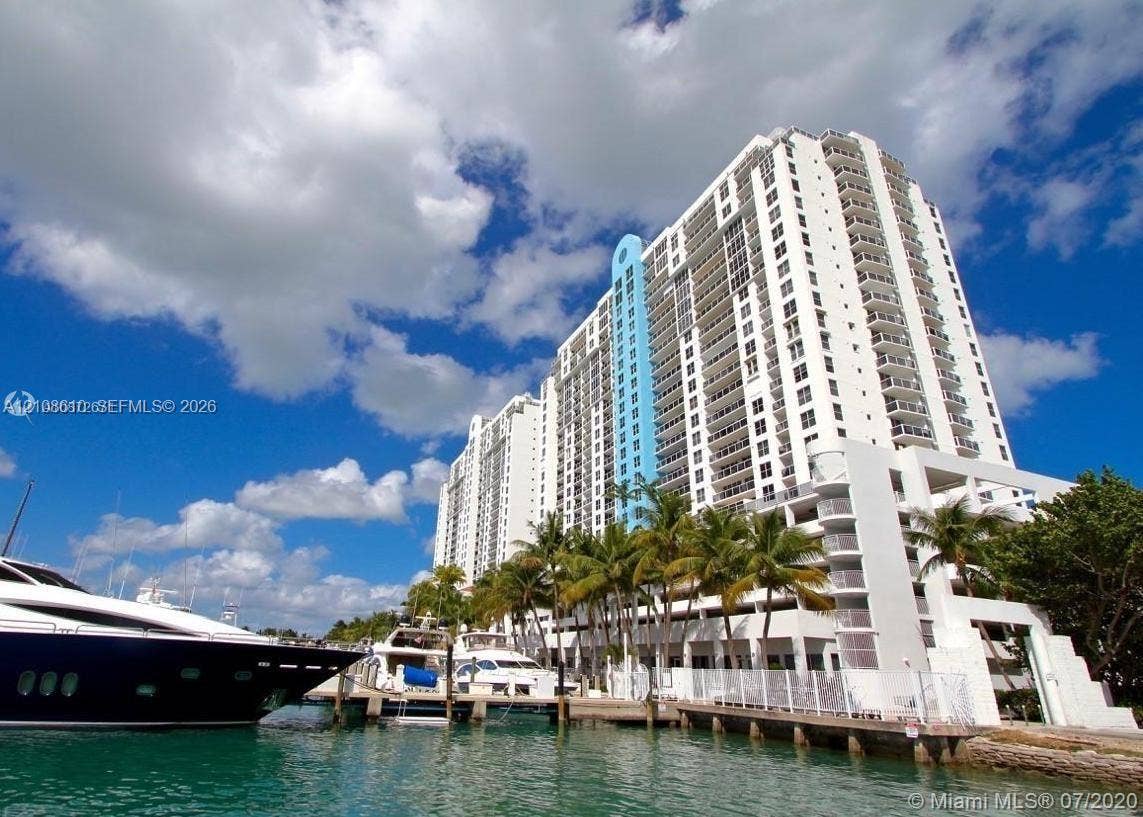 1900 Sunset Harbour Drive, #1210, Miami Beach, Miami Beach, FL 33139 High-rise building exterior featuring private dockage, balconies, and extensive glass windows