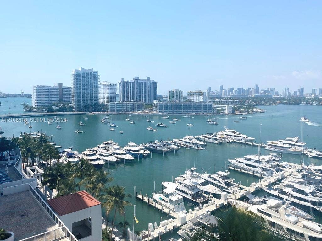 1900 Sunset Harbour Drive, #1210, Miami Beach, Miami Beach, FL 33139 Elevated outdoor terrace featuring a terracotta-tiled roofline, metal railing, and panoramic water, marina, and city skyline scenery