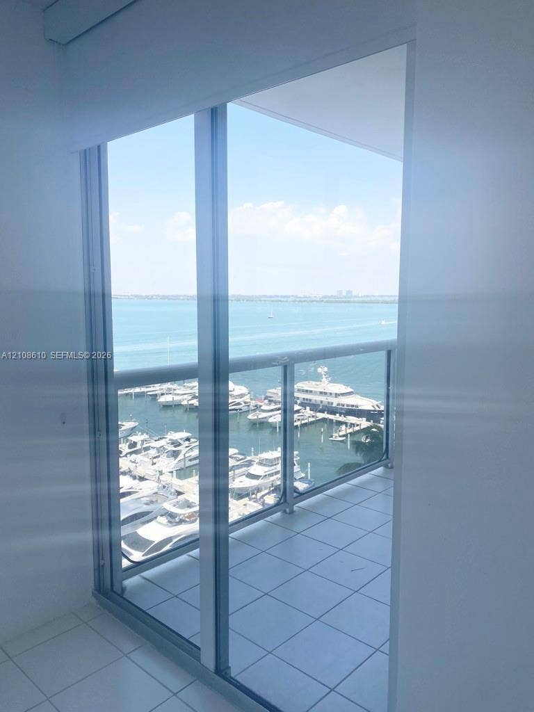 1900 Sunset Harbour Drive, #1210, Miami Beach, Miami Beach, FL 33139 Floor-to-ceiling sliding glass door, private balcony with tiled flooring, and metal railing overlooking the marina