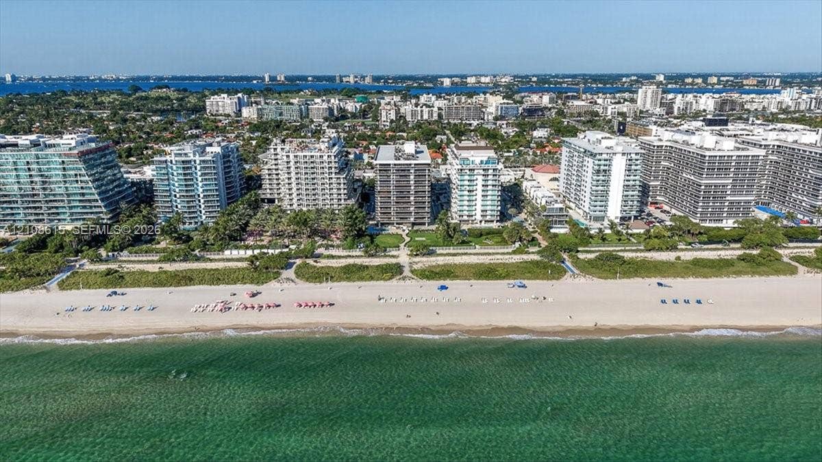 9455 Collins Avenue, #1201, Surfside, FL 33154 Aerial perspective of coastal high-rise properties featuring direct beach access, sandy shoreline, and proximity to ocean waters
