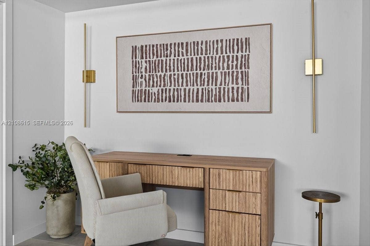 9455 Collins Avenue, #1201, Surfside, FL 33154 Vertical brass wall-mounted light fixtures with a minimalist aesthetic