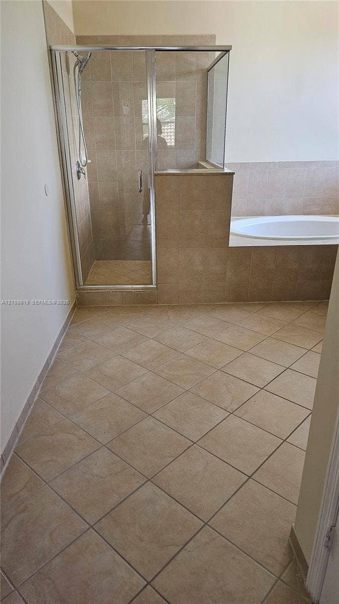 24041 SW 114th Place, #24041, Homestead, Homestead, FL 33032 Ceramic tile flooring, built-in soaking tub with a tiled surround, and a walk-in glass-enclosed shower with a handheld showerhead