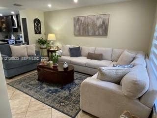 11511 SW 90th Terrace, Miami, FL 33176 Neutral tone walls, large-format tile flooring, and recessed ceiling lighting