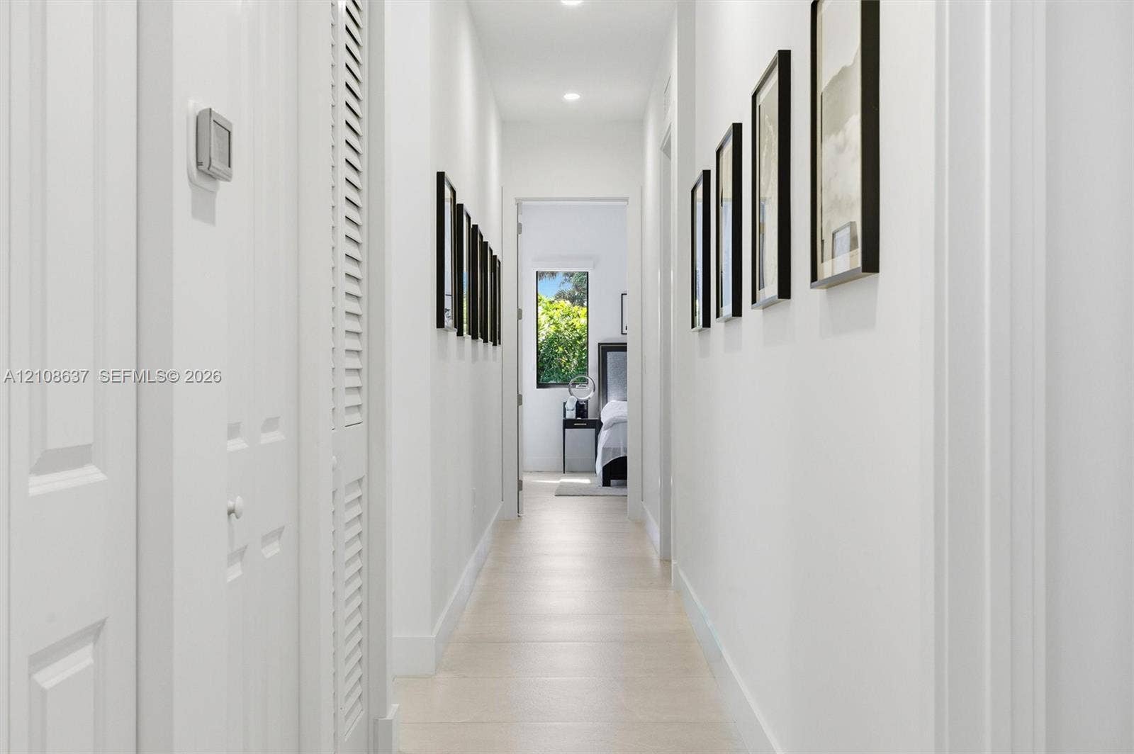 22900 SW 122nd Place, Miami, FL 33170 Hallway featuring light-toned tile flooring, recessed ceiling lighting, and louvered-style bi-fold closet doors