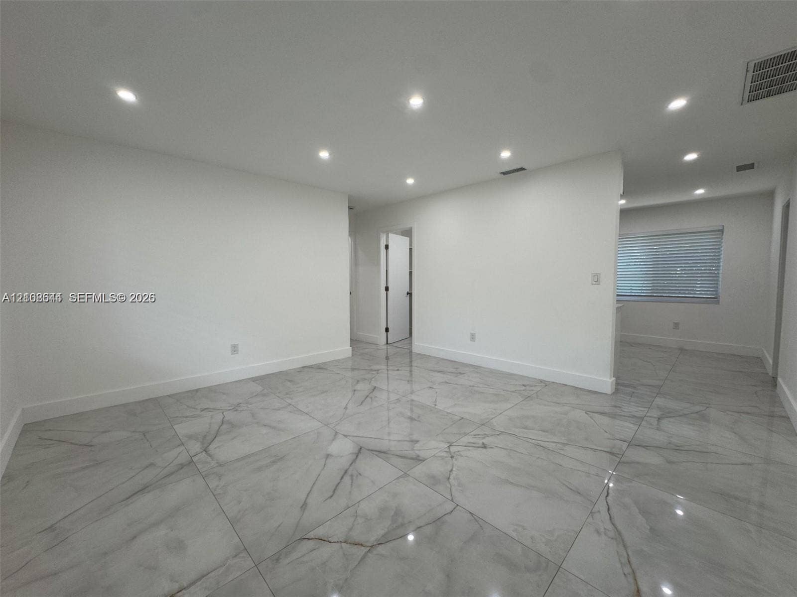 1431 N 14th Way, #rear, Hollywood, Hollywood, FL 33020 Open-concept interior featuring large-format polished stone-finish floor tiles and recessed ceiling lighting