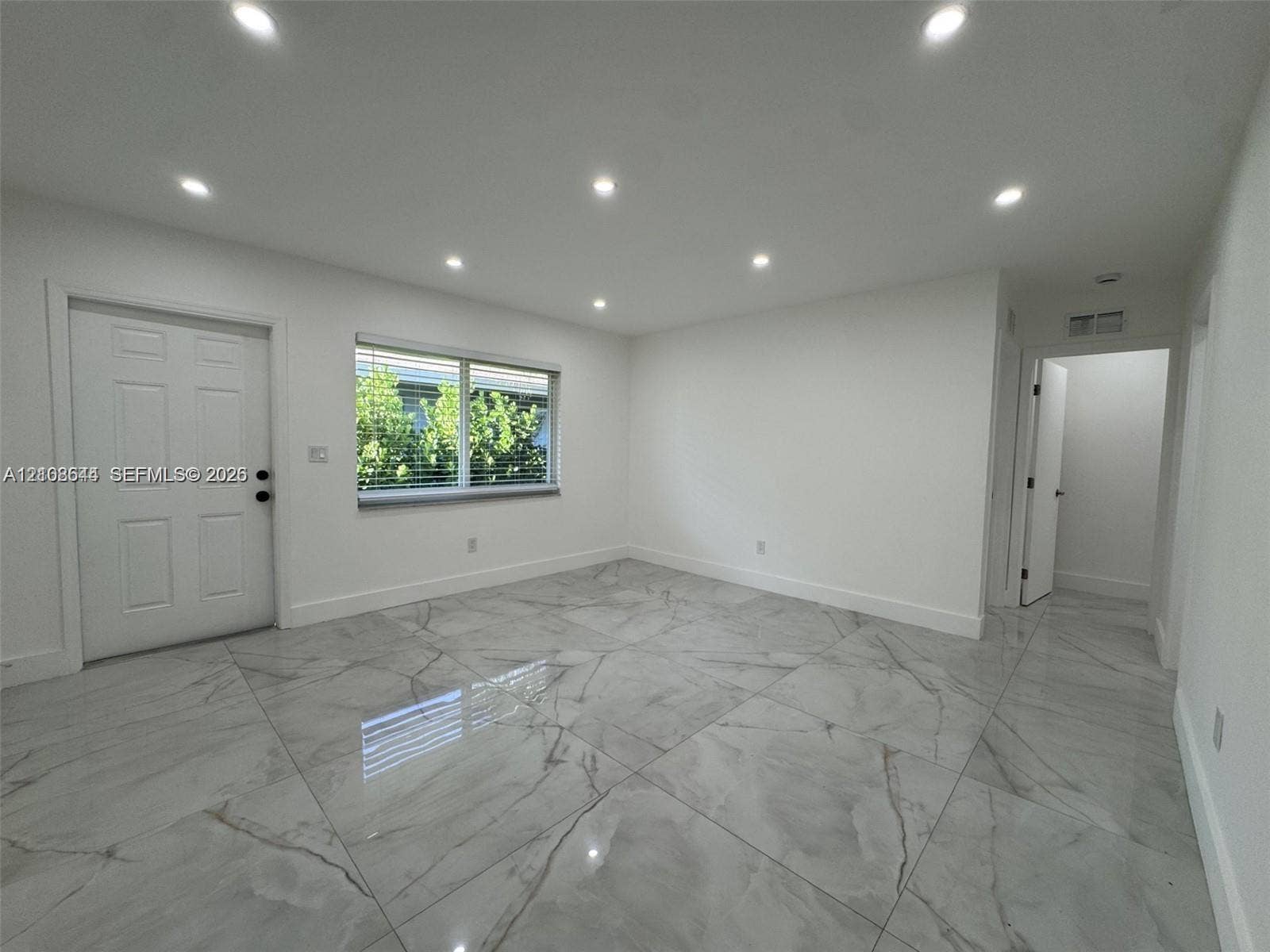 1431 N 14th Way, #rear, Hollywood, Hollywood, FL 33020 Large-format tile flooring, recessed ceiling lighting, and six-panel interior door