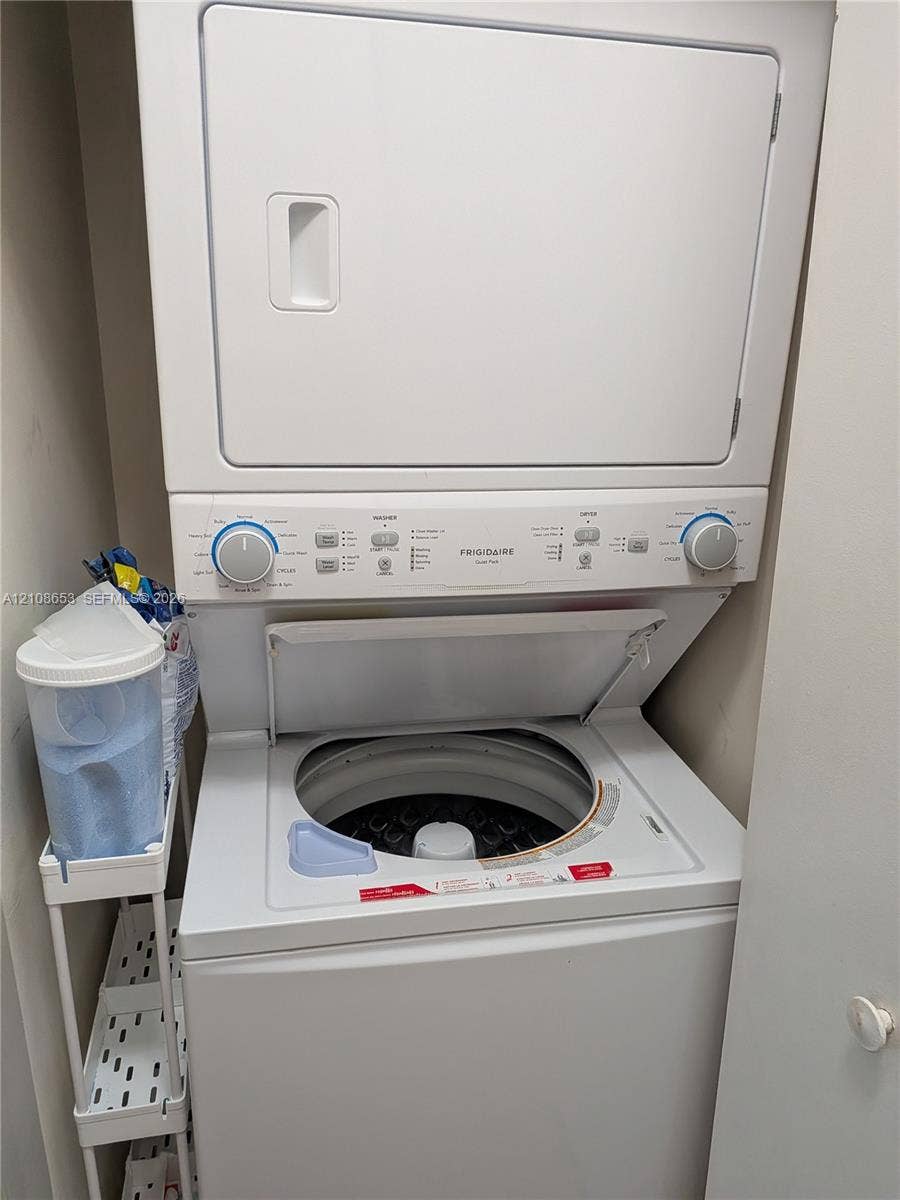 291 Duval Court, #0, Weston, Weston, FL 33326 Stacked Frigidaire laundry unit featuring a white top-loading washer and integrated dryer