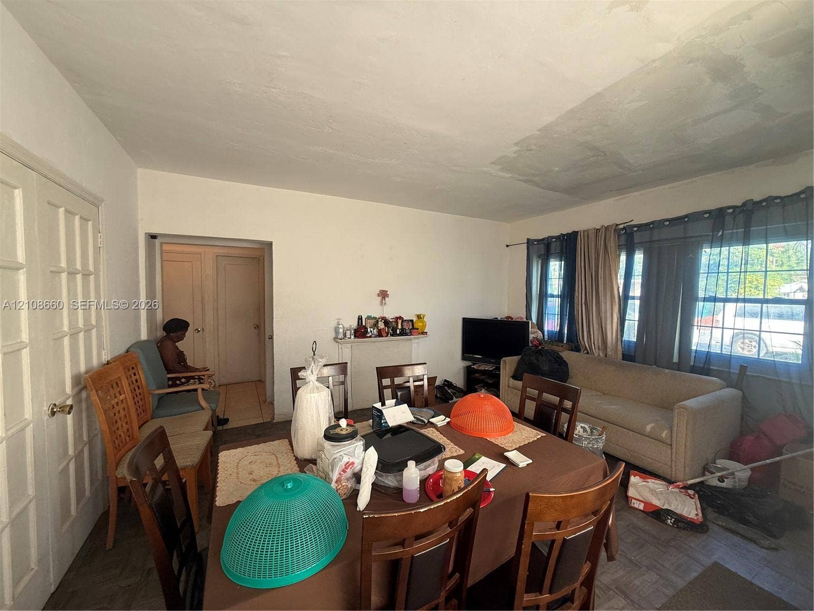 262 NE 111th Street, Miami, FL 33161 Interior space featuring parquet flooring, a decorative mantel, and multi-pane French doors