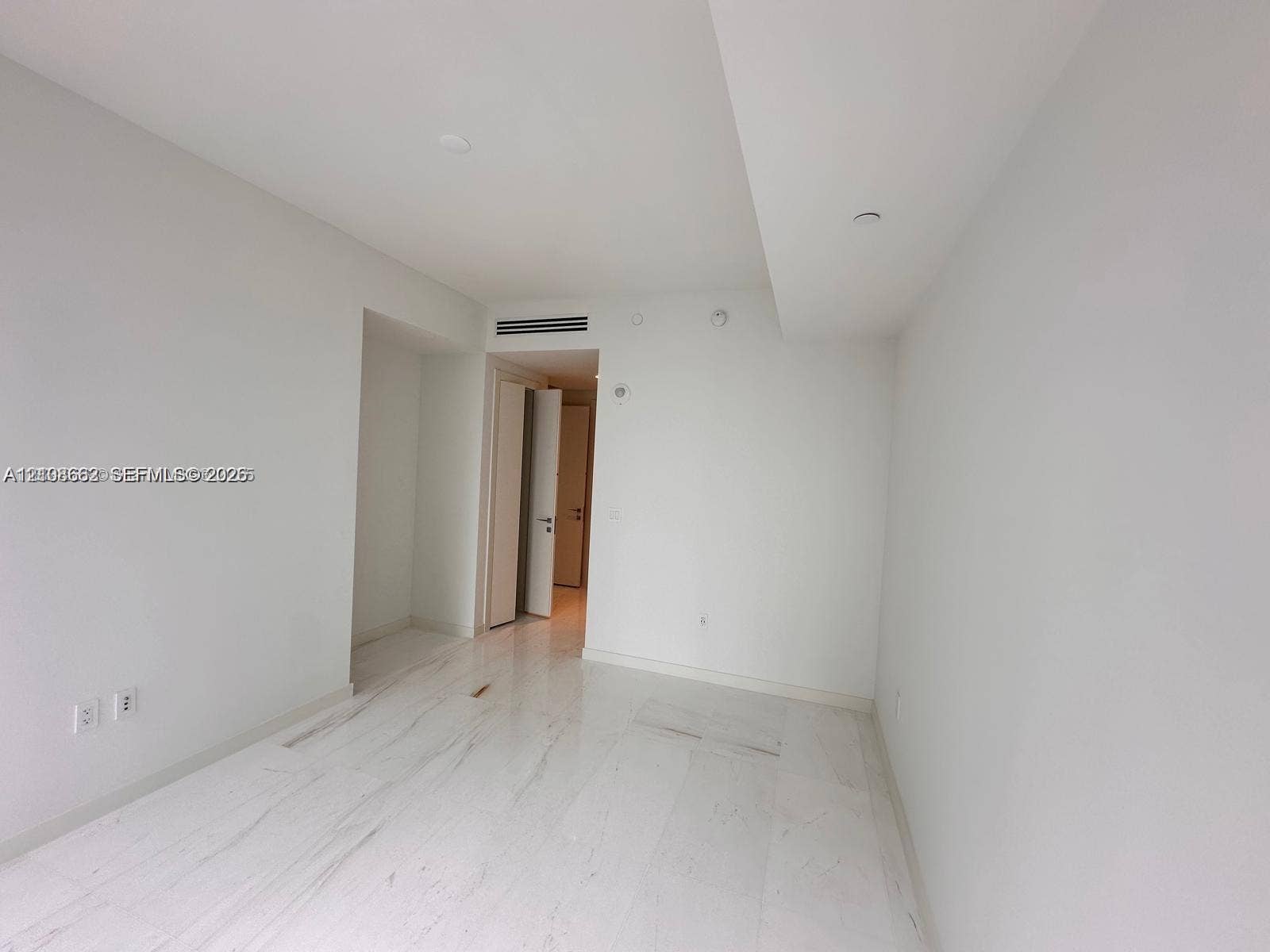 300 Biscayne Boulevard, #2709W, Miami, Miami, FL 33131 Open interior space featuring polished stone flooring, smooth high ceilings, and recessed lighting
