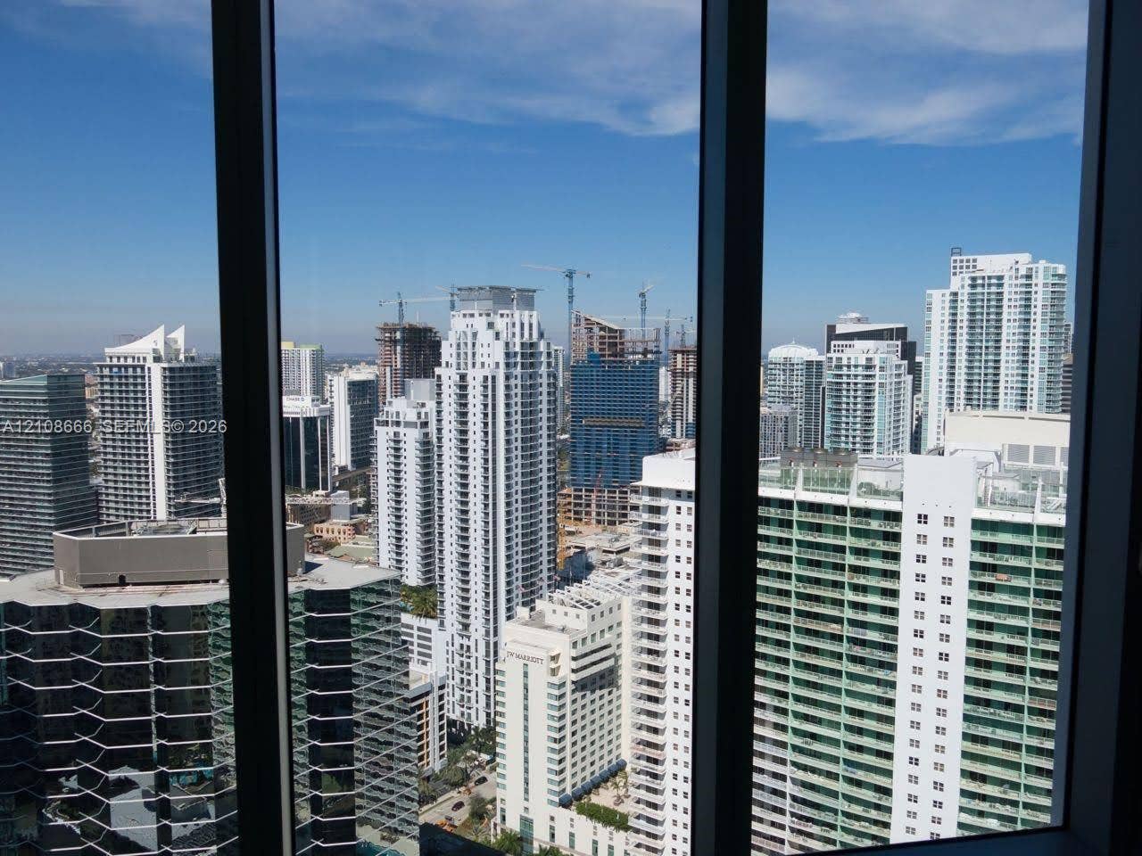 1300 Brickell Bay Drive, #3506, Miami, FL 33131 Floor-to-ceiling windows featuring expansive urban skyline exposure