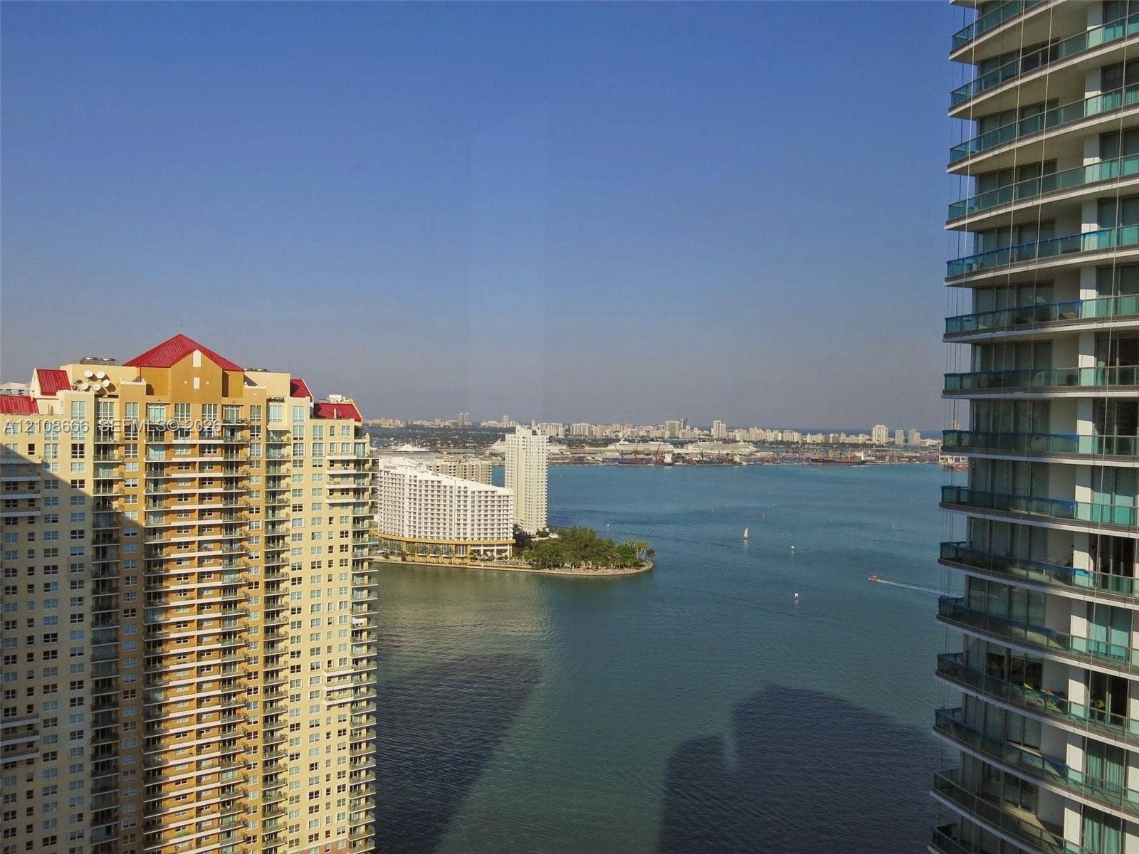 1300 Brickell Bay Drive, #3506, Miami, FL 33131 Elevated perspective of the coastal bay and cityscape, featuring expansive water frontage and multi-story high-rise architecture