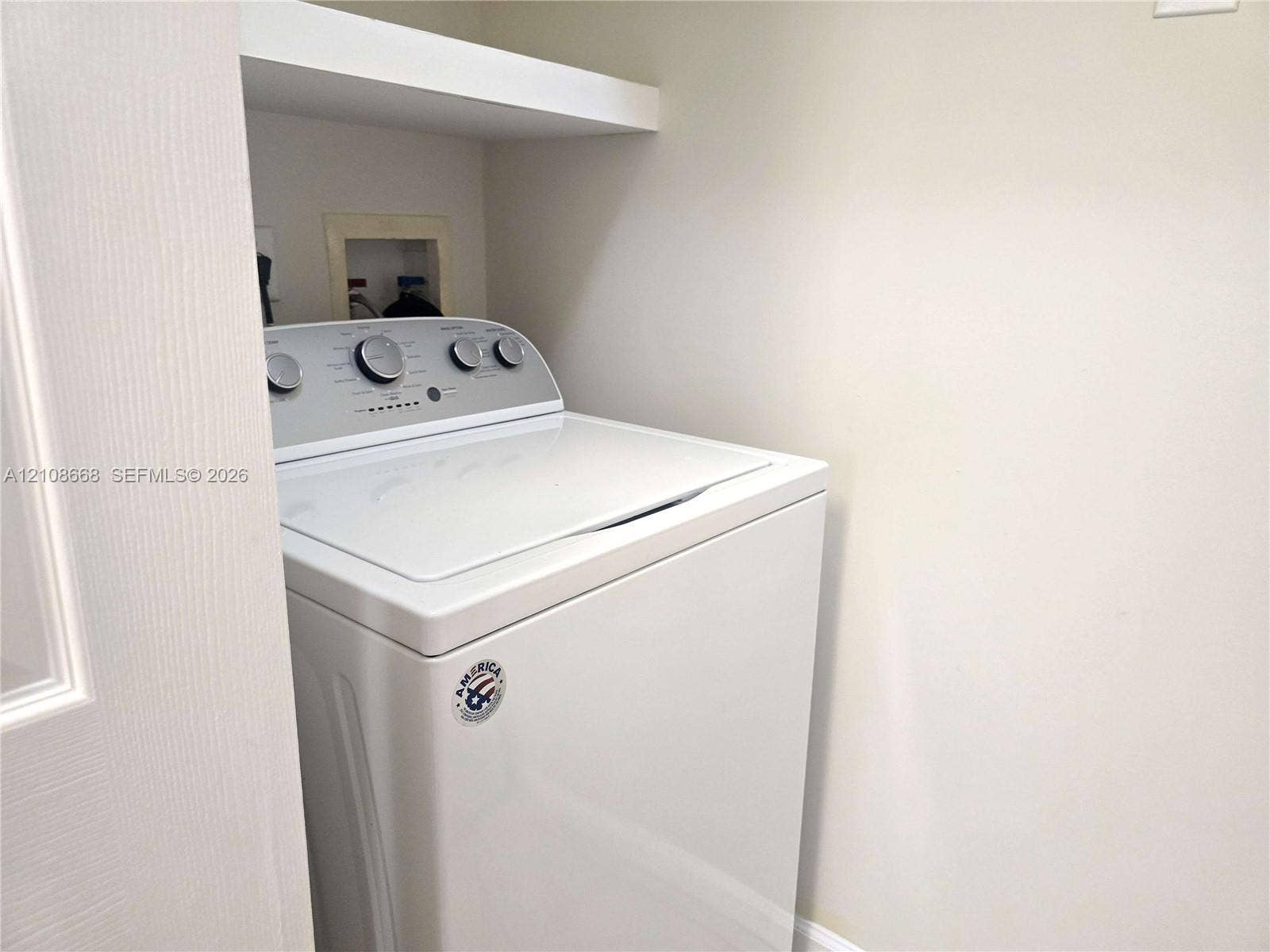 4508 SW 160th Avenue, #734, Miramar, Miramar, FL 33027 Laundry area featuring a built-in overhead storage shelf and recessed utility hookups