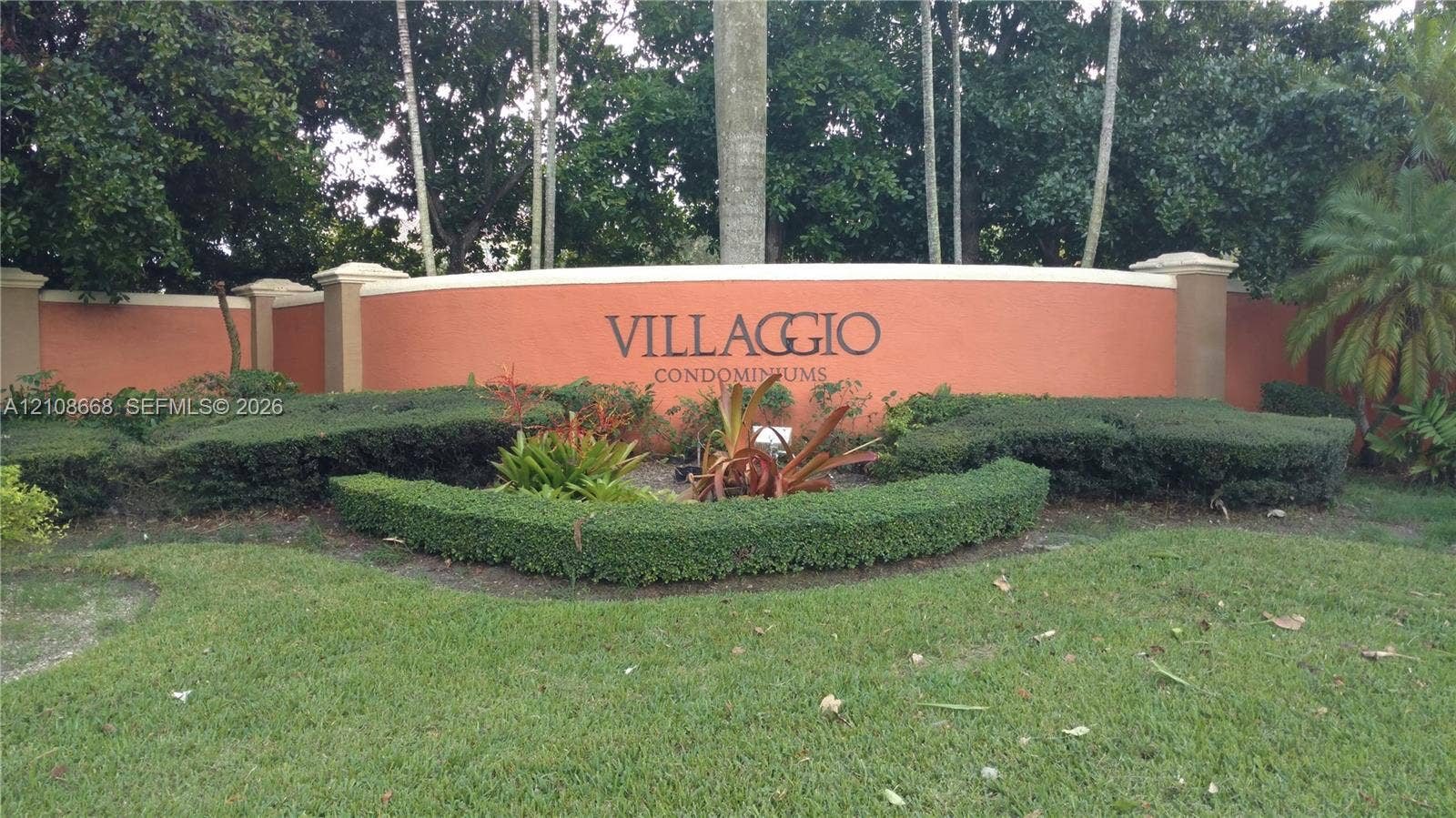 4508 SW 160th Avenue, #734, Miramar, Miramar, FL 33027 Curved stucco monument signage featuring architectural pillars and professionally maintained landscaping