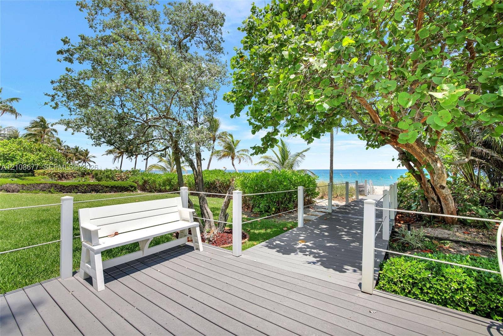 1440 S Ocean Boulevard, #11A, Lauderdale By The Sea, FL 33062 Elevated composite decking leads to mature coastal landscaping, and a direct path to the sandy oceanfront