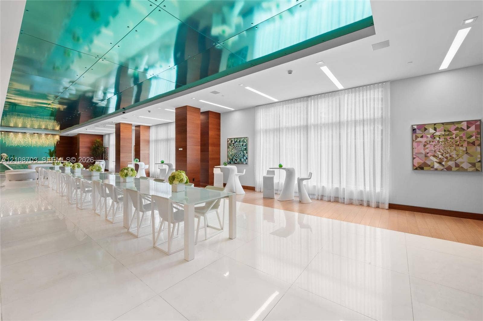 300 Sunny Isles Boulevard, #4-1501, Sunny Isles Beach, Sunny Isles Beach, FL 33160 Large-format polished tile flooring, reflective blue-tinted ceiling paneling, floor-to-ceiling windows with integrated drapery, wood-finish wall paneling, and recessed linear lighting