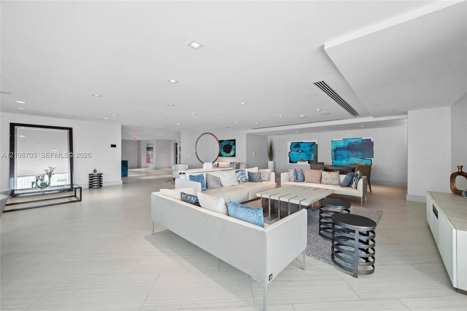 300 Sunny Isles Boulevard, #4-1501, Sunny Isles Beach, Sunny Isles Beach, FL 33160 Expansive living area featuring porcelain tile flooring, recessed lighting, soffit ceiling detailing, and built-in linear HVAC registers