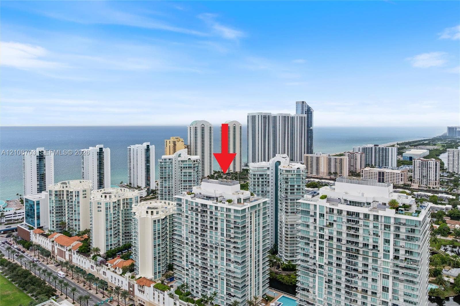 300 Sunny Isles Boulevard, #4-1501, Sunny Isles Beach, Sunny Isles Beach, FL 33160 High-rise residential building featuring expansive glass balconies and coastal surroundings