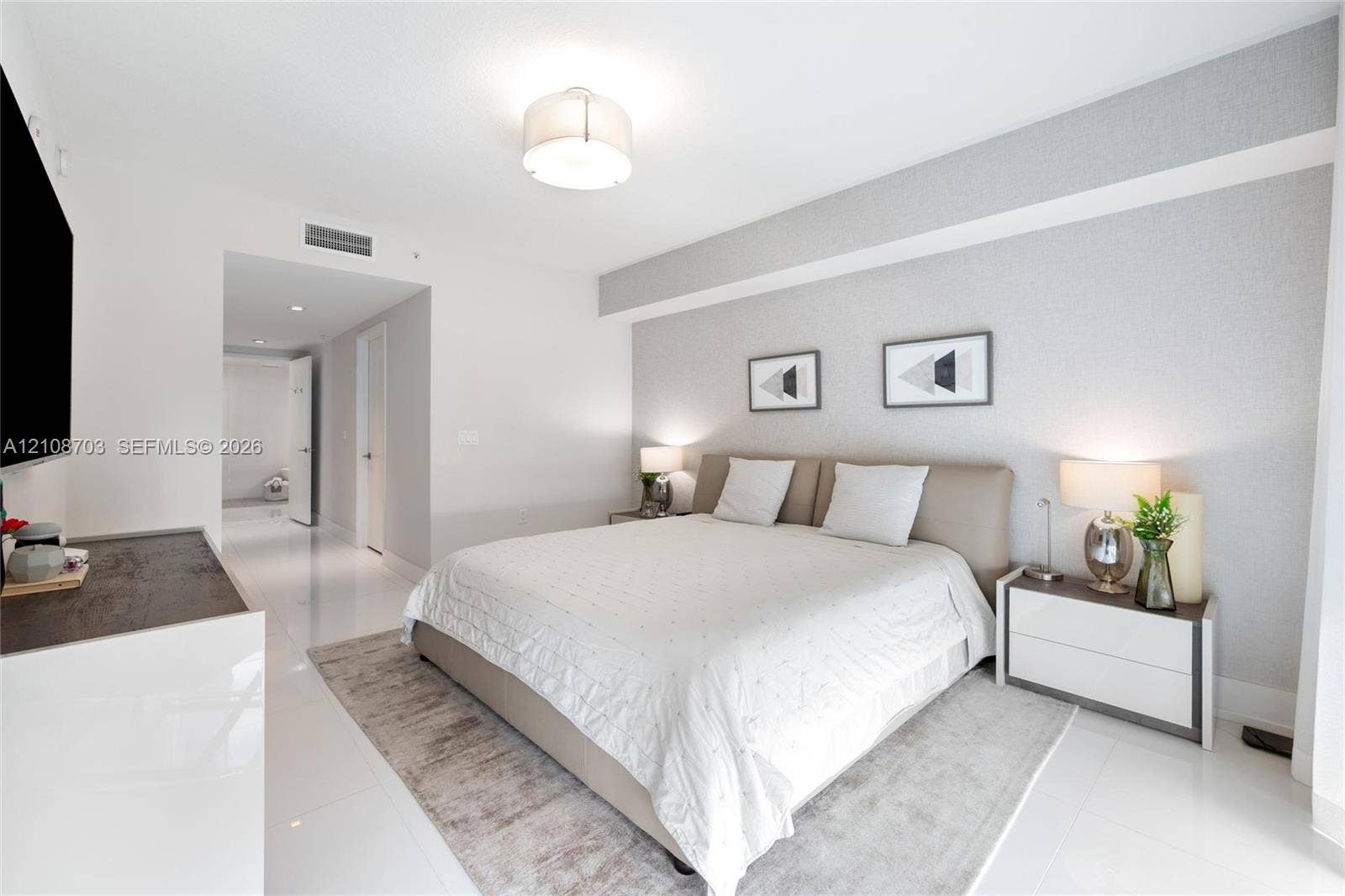 300 Sunny Isles Boulevard, #4-1501, Sunny Isles Beach, Sunny Isles Beach, FL 33160 Neutral-toned textured accent wall, polished light-colored flooring, minimalist drum-style ceiling light fixture, and recessed lighting