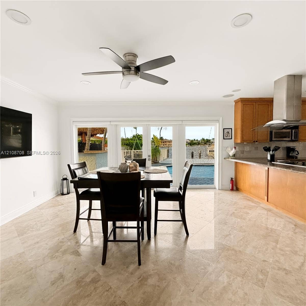 Open dining area with stone floors