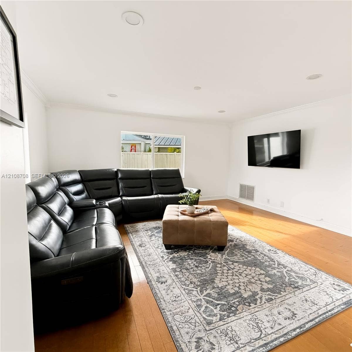 Living room with wood floors and natural light