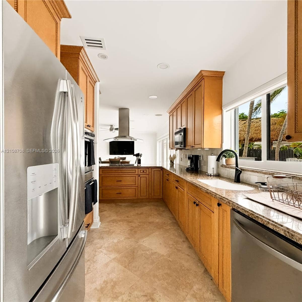 Kitchen with wood cabinetry and stainless appliances