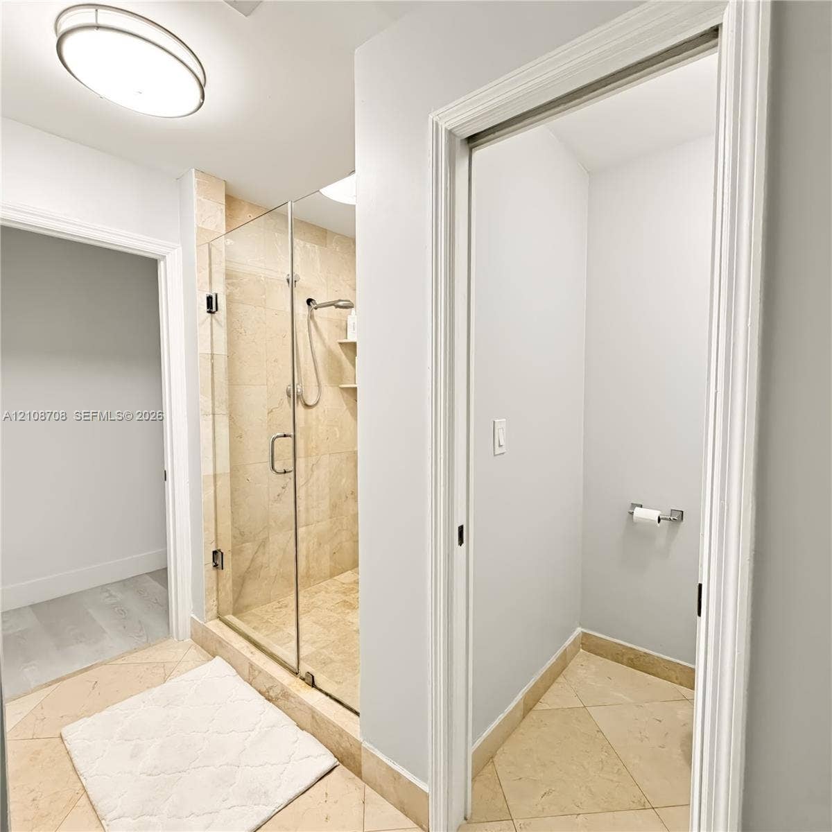Primary bathroom with glass walk in shower