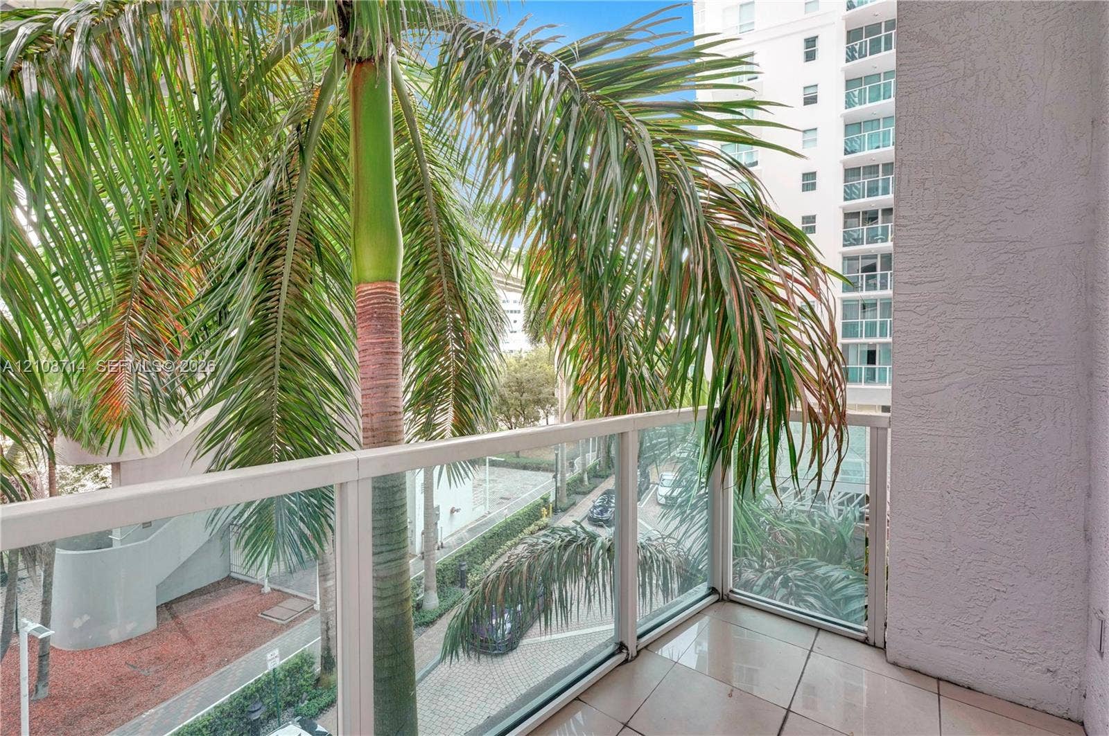 41 SE 5th Street, #317, Miami, Miami, FL 33131 Private balcony featuring tile flooring and a glass-paneled railing
