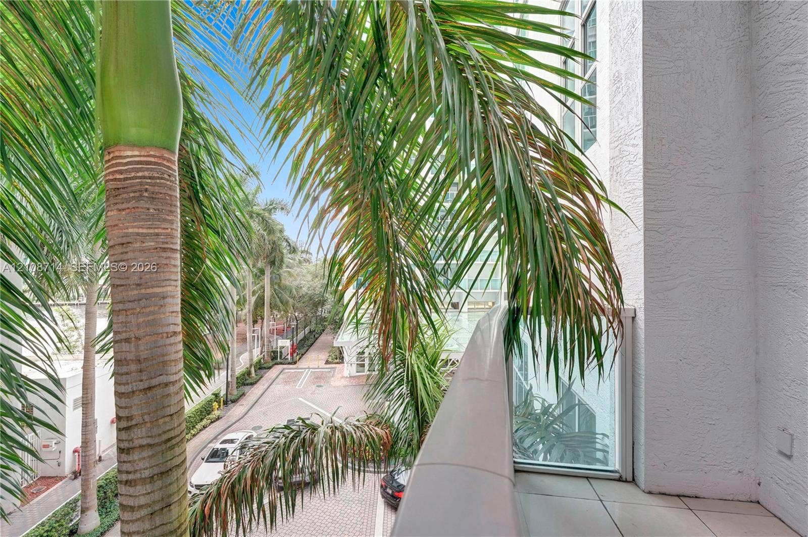 41 SE 5th Street, #317, Miami, Miami, FL 33131 Private balcony with tile flooring and a glass-paneled railing