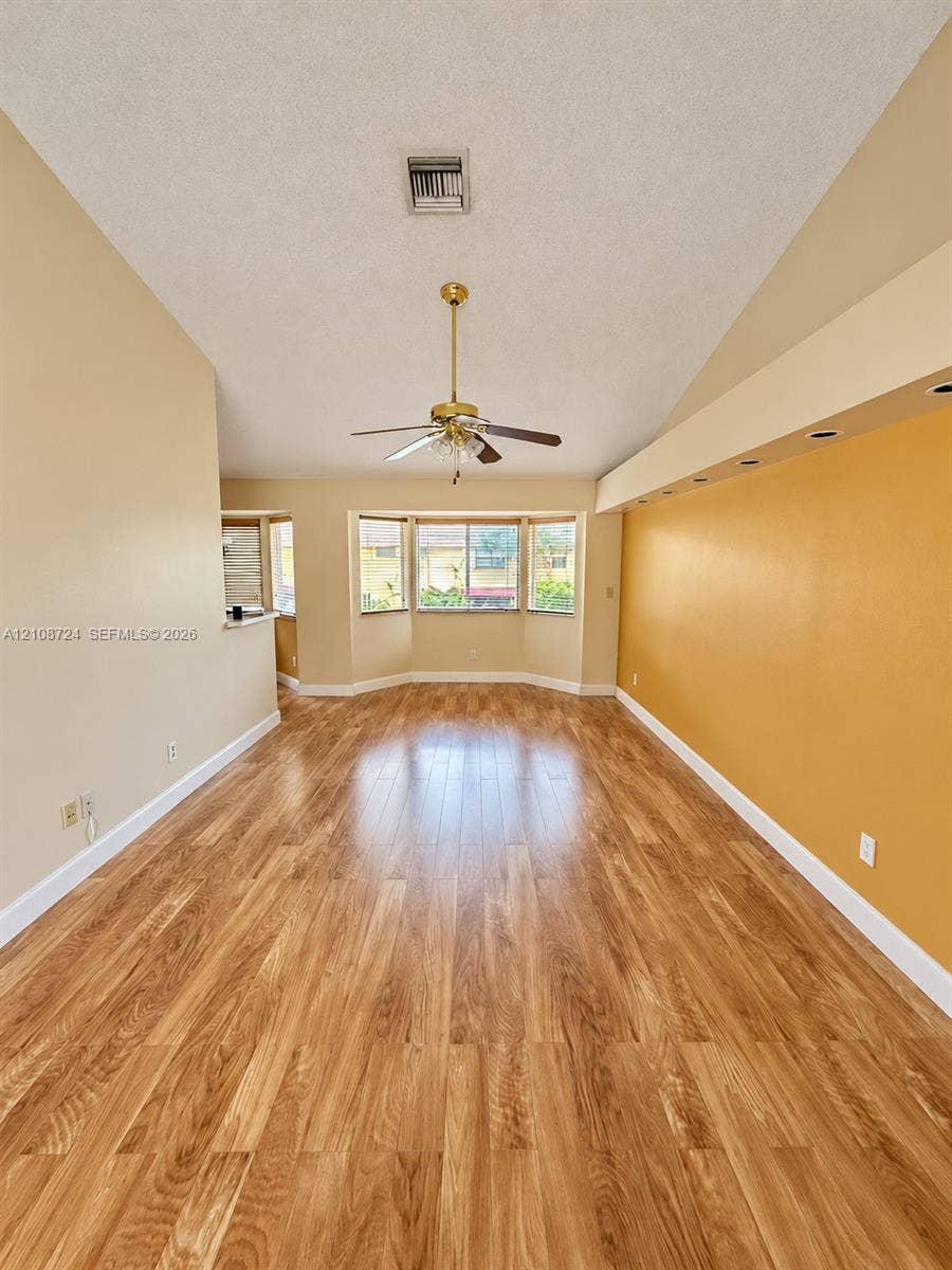 972 NW 92nd Terrace, Plantation, Plantation, FL 33324 Vaulted ceilings, wood-finish flooring, recessed lighting, and a bay window