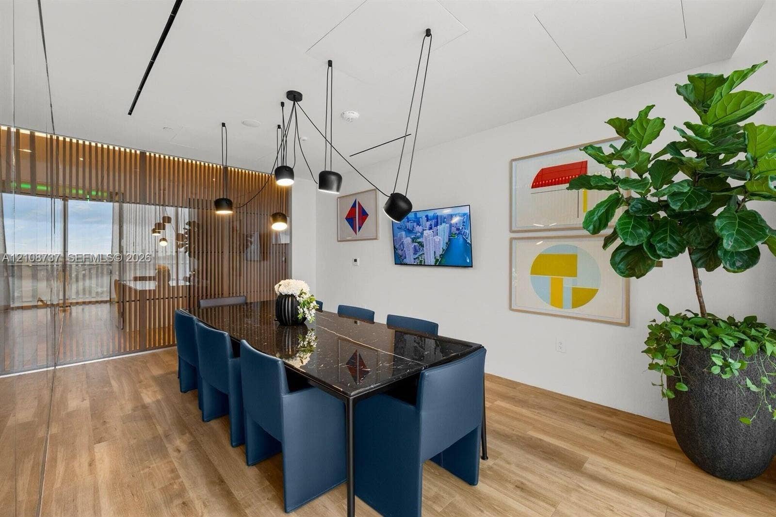 1400 Biscayne Boulevard, #3503, Miami, Miami, FL 33132 Wood-finish flooring, multi-light contemporary pendant fixture, and decorative wood-slat privacy screen