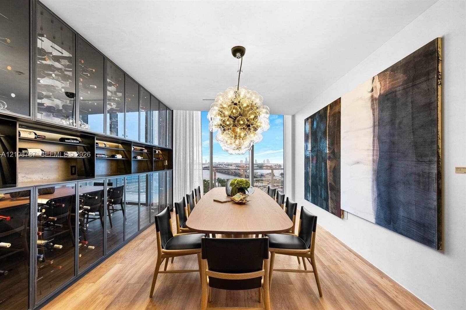 1400 Biscayne Boulevard, #3503, Miami, Miami, FL 33132 Built-in floor-to-ceiling glass-front cabinetry with integrated shelving, wood-finish flooring, multi-globe chandelier, and expansive windows