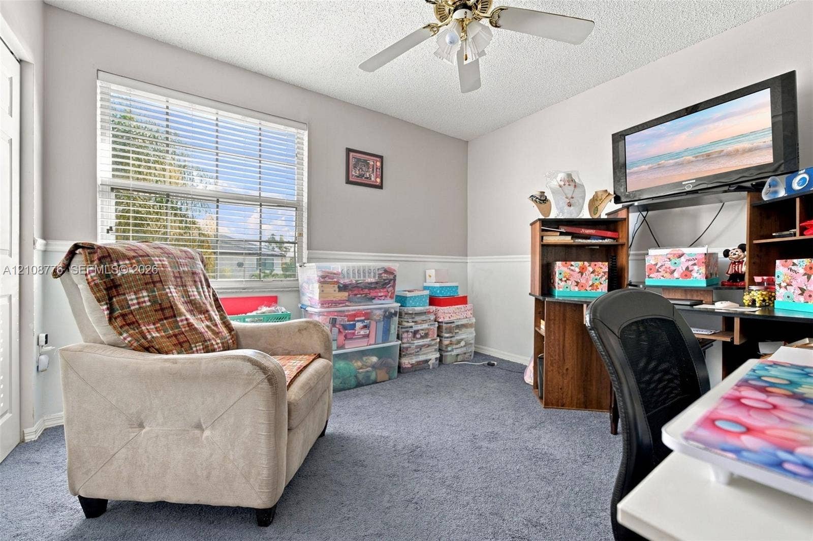 18041 SW 33rd Street, Miramar, FL 33029 Room featuring wall-to-wall carpeting, horizontal window blinds, chair rail molding, and a ceiling fan with integrated light fixture