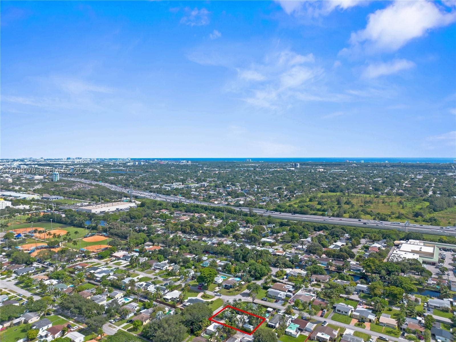3116 Hayes Street, Hollywood, FL 33021 Aerial perspective of property featuring a marked boundary line, encompassing dense mature tree canopy and vegetation