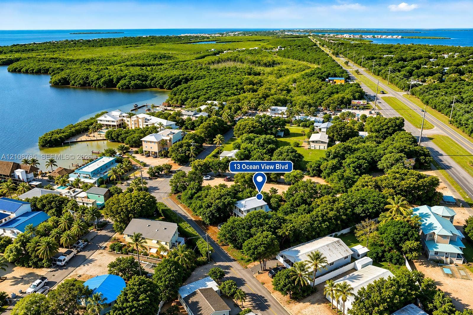 Aerial perspective featuring dense mature tree cover, proximity to coastal waterways, and established coastal vegetation