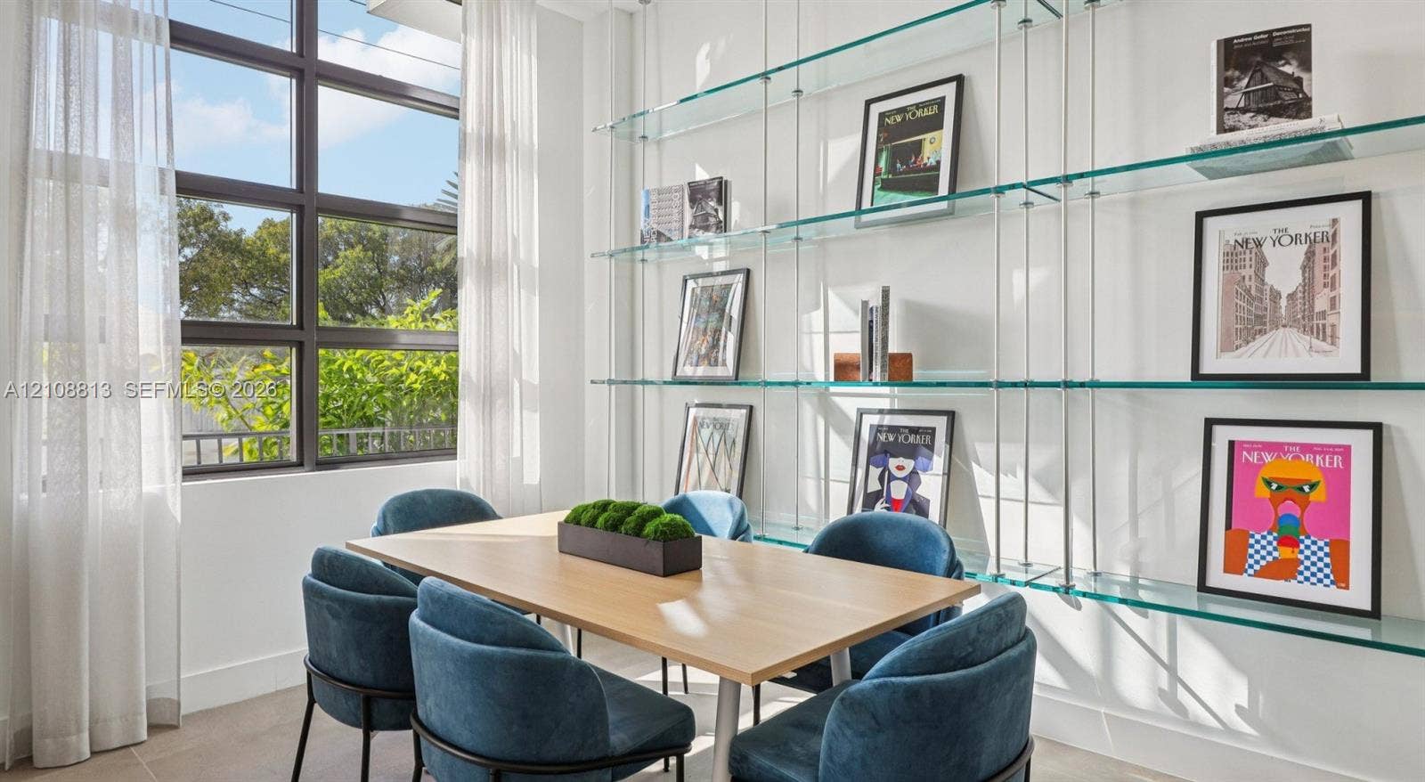 Floor-to-ceiling multi-pane window with dark metal framing and custom wall-mounted glass shelving system with brushed metal supports