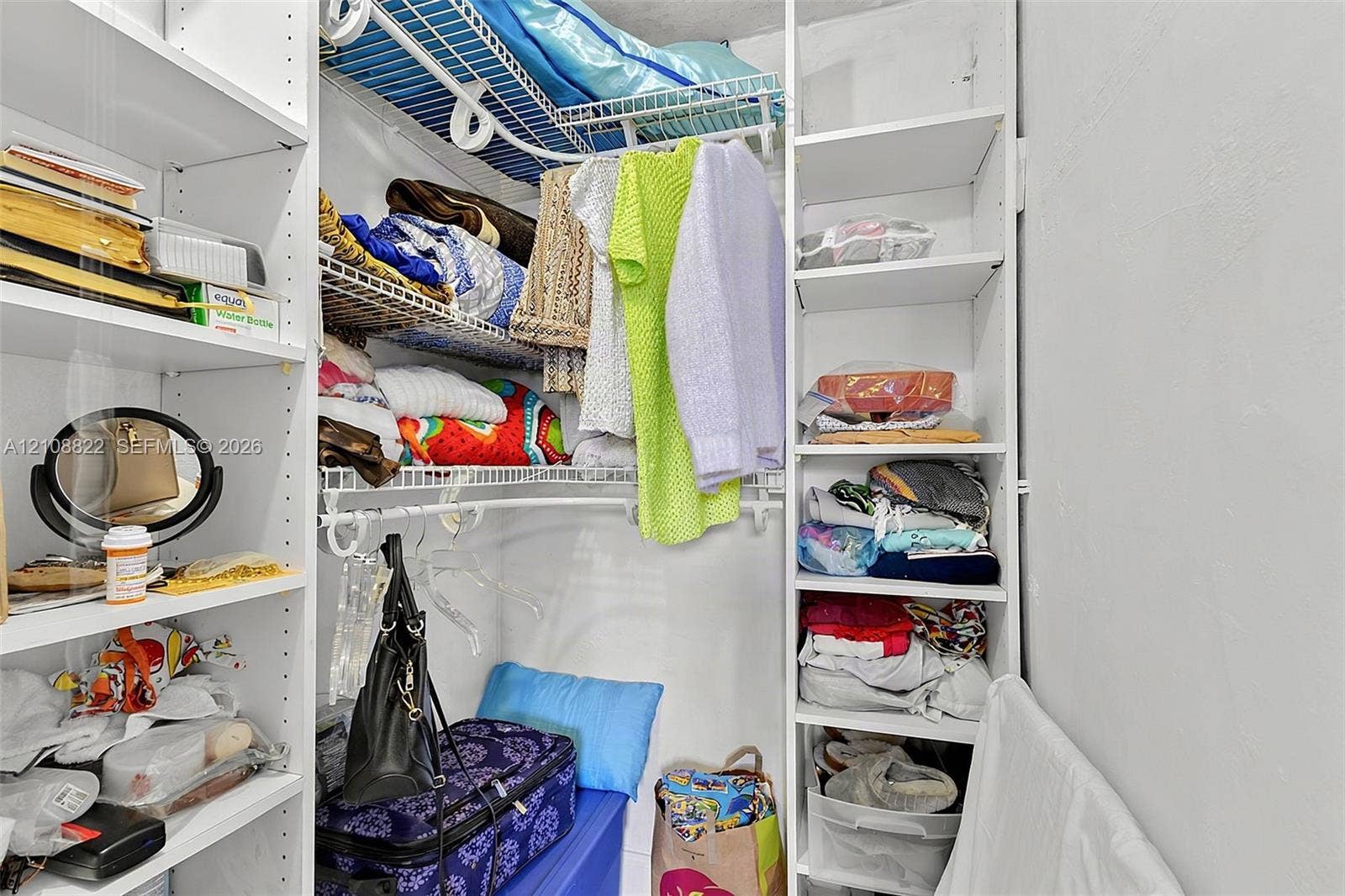 6838 SW 22nd Court, Miramar, FL 33023 Walk-in closet featuring white built-in shelving and wire garment racks