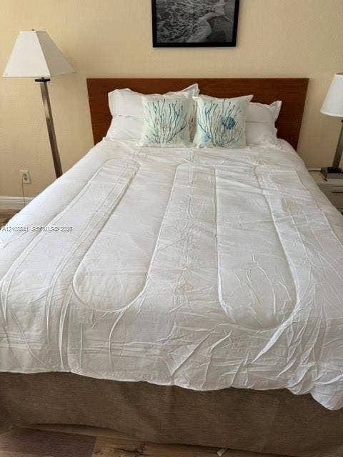 Wood-finish headboard and wood-finish flooring