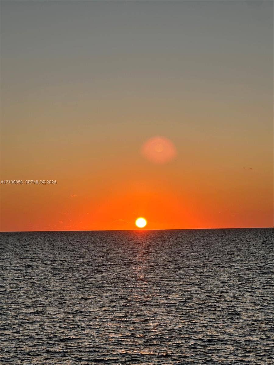 Ocean horizon featuring a prominent sunset backdrop