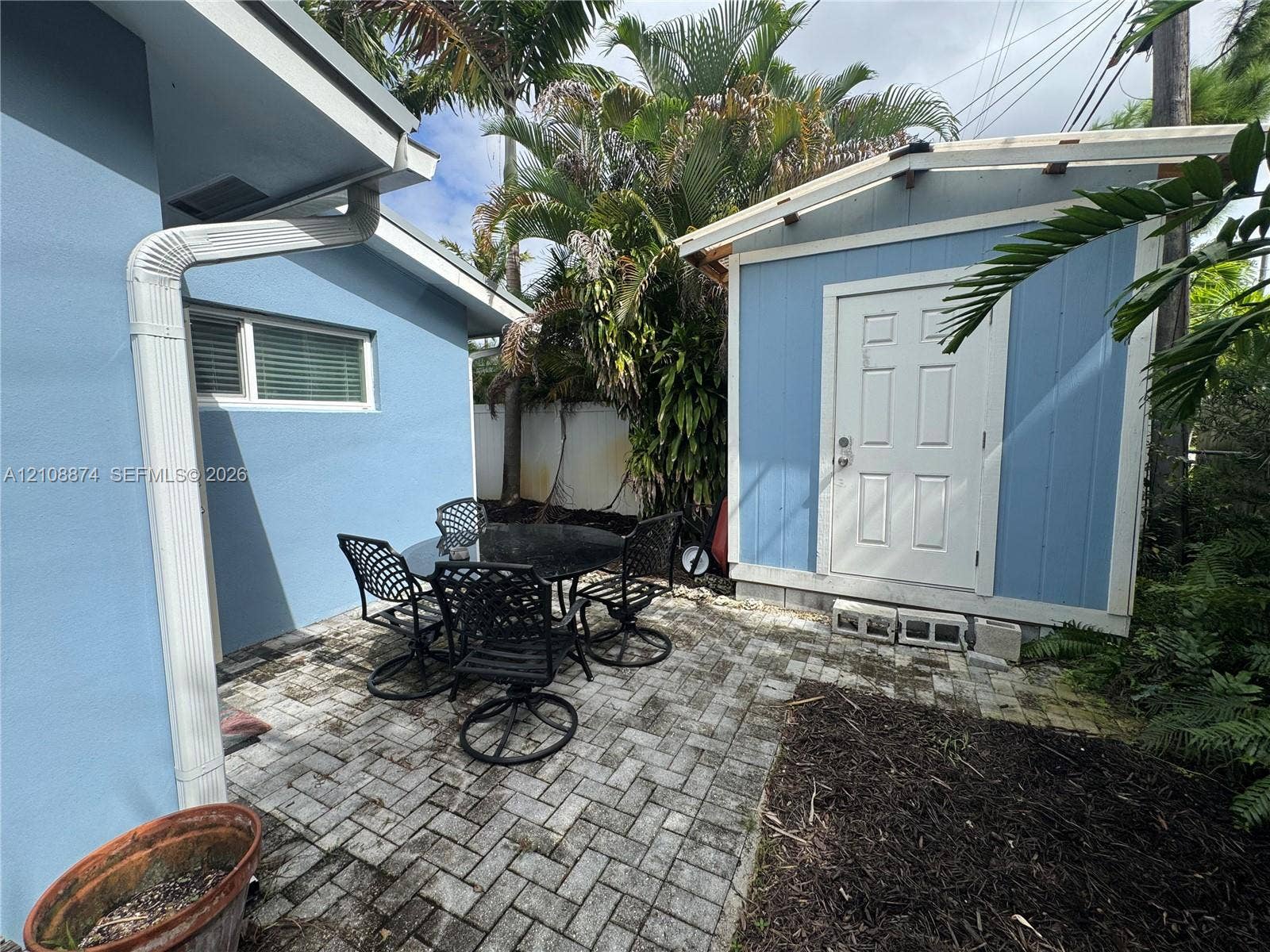 44 NE 16th Court, #2, Fort Lauderdale, Fort Lauderdale, FL 33305 Paver patio featuring a standalone storage structure and mature landscaping