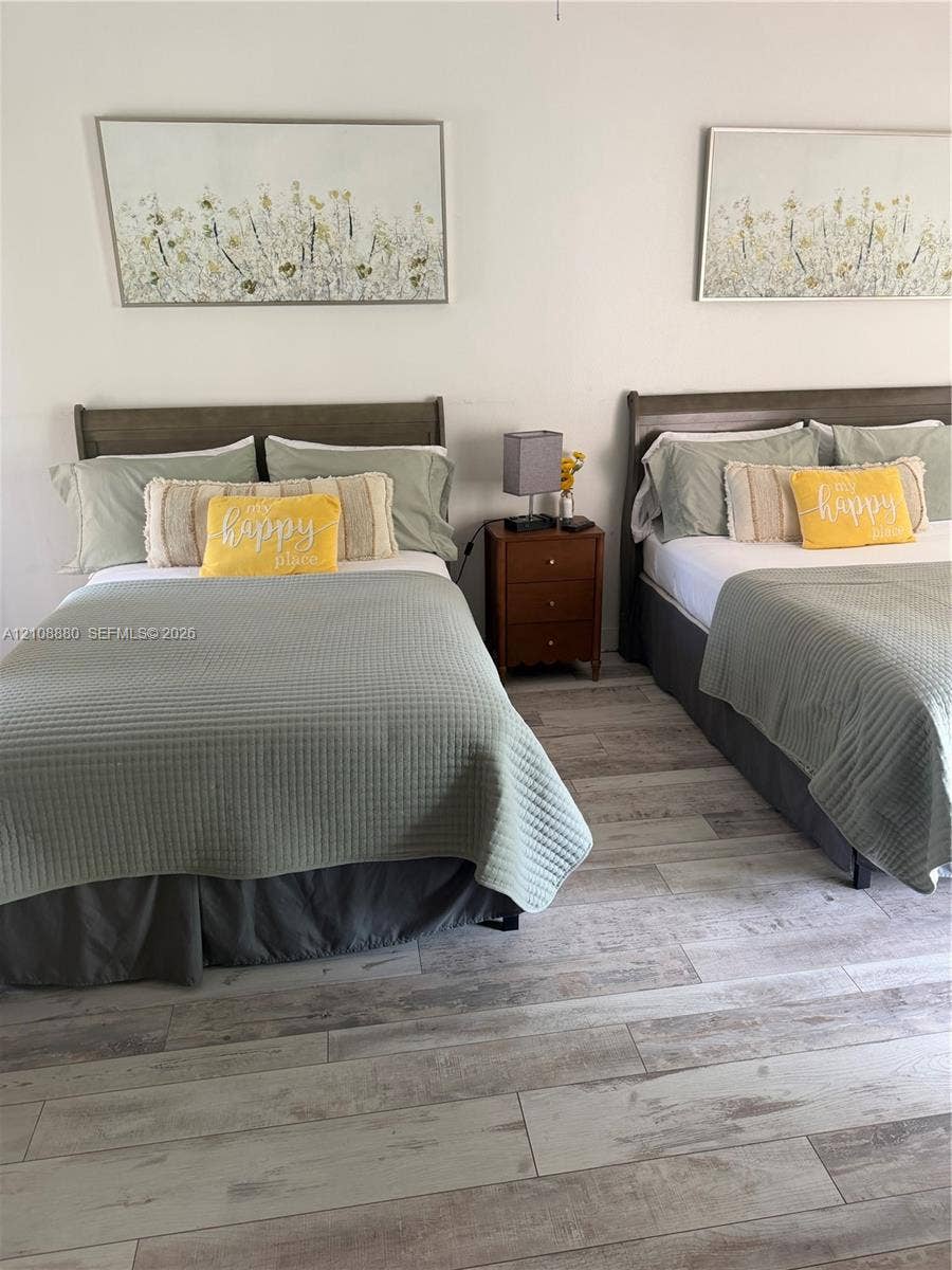 Neutral-toned wood-finish flooring throughout
